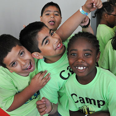 students with kroc camp tshirts